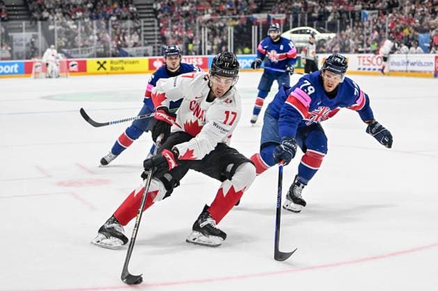 PRAGUE, CZECH REPUBLIC - MAY 11: Jack Mcbain of Canada protects the puck against Nathanael Halbert of Great Britain during the preliminary round match between Great Britain and Canada at Prague Arena on May 11, 2024 in Prague, Czech Republic. Prague Prague Arena Czech Republic Copyright: xJustPictures.ch AndreaxBrancax jp-en-EuSpIm-AB_11052024_AAB_4745