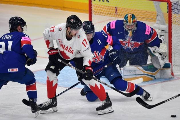 May 11, 2024, Prague, Czech Republic: JACK MCBAIN of Canada (17) and MARK RICHRDSON (17 blue) and goalkeeper JAKSON WHISTLE of Great Britain during the 2024 IIHF Ice hockey, Eishockey World Championship, WM, Weltmeisterschaft match between Great Britain and Canada at the O2 arena in Prag, Czech Republic, May 11, 2024. Prague Czech Republic - ZUMAr156 20240511_aap_r156_015 Copyright: xSlavekxRutax