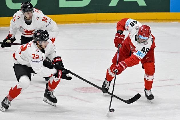Denmark vs Canada group A match of the 2024 IIHF World Championship, WM, Weltmeisterschaft in Prague, Czech Republic, on May 12, 2024. From left Dylan Guenther of Canada, Dylan Cozens of Canada, Nicholas B. Jensen of Denmark. (CTKxPhoto VitxSimanek) CTKPhotoP2024051204529  CTKPhotoP2024051204529