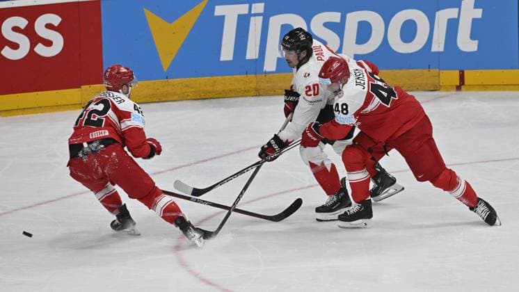 Denmark vs Canada group A match of the 2024 IIHF World Championship, WM, Weltmeisterschaft in Prague, Czech Republic, on May 12, 2024. From left Phillip Bruggisser of Denmark, Nick Paul of Canada, B. Jensen Nicholas of Denmark. (CTKxPhoto VitxSimanek) CTKPhotoP2024051204771  CTKPhotoP2024051204771