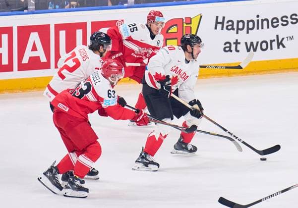Nick Paul CAN 20 compete, fight for the puck against, Oliver LAURIDSEN, DEN 25, Patrick RUSSELL, DEN 63 in the preliminary round match DENMARK - CANADA of the IIHF Ice hockey, Eishockey World Championship, WM, Weltmeisterschaft Group A in Prague, Czechia, May 12, 2024, Season 2023 2024