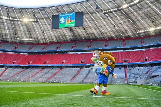 Munich, Bavaria, Germany - 13 May 2024: EURO 2024 soccer theme picture: European Championship, EM, Europameisterschaft Albärt mascot stands on the Allianz Arena pitch together with the official Adidas match ball and the UEFA EURO, EM, Europameisterschaft,Fussball 2024 Henri Delaunay Cup