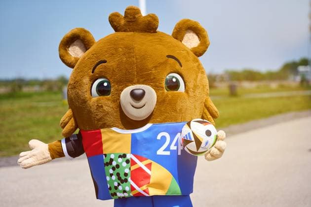 Munich, Bavaria, Germany - May 13, 2024: The official mascot of UEFA EURO, EM, Europameisterschaft,Fussball 2024 Albärt holding an official Adidas soccer ball