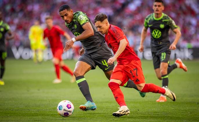 Munich, Germany.12th Mai 2024. Bryan Zaragoza (Muenchen) Maxence Lacroix (Wolfsburg) FC Bayern Munich - VfL Wolfsburg 12.05.2024
