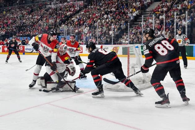 PRAGUE, CZECH REPUBLIC - MAY 14: goalkeeper David Madlener of Austria and Paul Stapelfeldt of Austria battle for the puck during the preliminary round match between Canada and Austria at Prague Arena on May 14, 2024 in Prague, Czech Republic. Prague Czech Republic Copyright: xJustPictures.ch AndreaxBrancax jp-en-EuSpIm-AB_14052024_DSC_0220