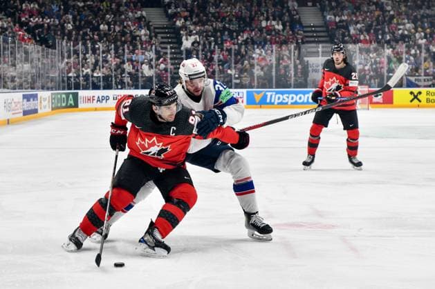 PRAGUE, CZECH REPUBLIC - MAY 16: John Tavares of Canada protects the puck from Markus Vikingstad of Norway during the preliminary round match between Canada and Norway at Prague Arena on May 16, 2024 in Prague, Czech Republic. Prague Prague Arena Czech Republic Copyright: xJustPictures.ch AndreaxBrancax jp-en-EuSpIm-AB_16052024_DSC_1788