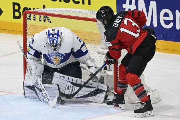 Brandon Tanev of Canada, right, scores a goal past goalkeeper of Finland Harri Sateri during the 2024 IIHF World Championship, WM, Weltmeisterschaft group A match Canada vs Finland in Prague, Czech Republic, May 18, 2024. (CTKxPhoto VitxSimanek) CTKPhotoP2024051804467  CTKPhotoP2024051804467