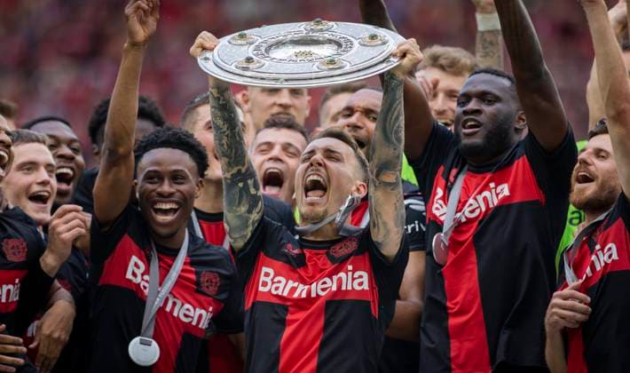 Leverkusen, Germany. 18th Mai 2024. Alejandro Grimaldo (Leverkusen) mit Meisterschale, Nathan Tella (Leverkusen) Victor Boniface (Leverkusen) Bayer Leverkusen - FC Augsburg 18.05.2024