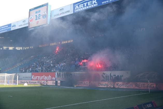 19.05.2024, xtgx, Fussball 2. Bundesliga, FC Hansa Rostock - SC Paderborn 07, v.l. Ausschreitungen, Krawall, Pyro, enttaeuscht, enttäuscht, schaut enttaeuscht, niedergeschlagen, disappointed (DFL DFB REGULATIONS PROHIBIT ANY USE OF PHOTOGRAPHS as IMAGE SEQUENCES and or QUASI-VIDEO) Rostock