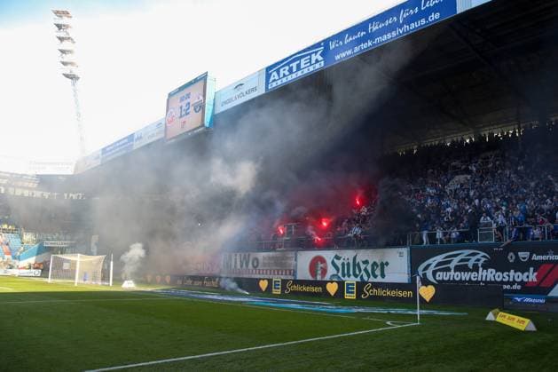 19.05.2024, xtgx, Fussball 2. Bundesliga, FC Hansa Rostock - SC Paderborn 07, v.l. Ausschreitungen, Krawall, Pyro, enttaeuscht, enttäuscht, schaut enttaeuscht, niedergeschlagen, disappointed (DFL DFB REGULATIONS PROHIBIT ANY USE OF PHOTOGRAPHS as IMAGE SEQUENCES and or QUASI-VIDEO) Rostock