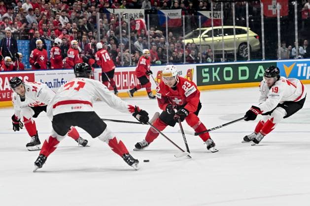 PRAGUE, CZECH REPUBLIC - MAY 19: Philipp Kurashev of Switzerland battles for the puck against Jared Mccann of Canada (R) and Dylan Guenther of Canada (L) during the preliminary round match between Switzerland and Canada at Prague Arena on May 19, 2024 in Prague, Czech Republic. Prague Prague Arena Czech Republic Copyright: xJustPictures.ch AndreaxBrancax jp-en-EuSpIm-AB_19052024_AAB_7432