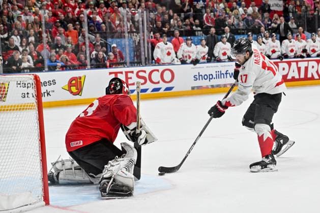 PRAGUE, CZECH REPUBLIC - MAY 19: Jack McBain of Canada tries to score against goalkeeper Leonardo Genoni of Switzerland during the preliminary round match between Switzerland and Canada at Prague Arena on May 19, 2024 in Prague, Czech Republic. Prague Prague Arena Czech Republic Copyright: xJustPictures.ch AndreaxBrancax jp-en-EuSpIm-AB_19052024_AAB_8675