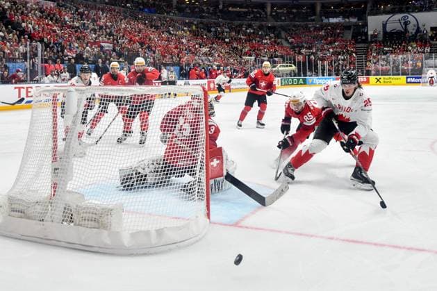 PRAGUE, CZECH REPUBLIC - MAY 19: Owen Power of Canada in a battle for the puck against Sven Andrighetto of Switzerland andgoalkeeper Leonardo Genoni of Switzerland during the preliminary round match between Switzerland and Canada at Prague Arena on May 19, 2024 in Prague, Czech Republic. Prague Prague Arena Czech Republic Copyright: xJustPictures.ch AndreaxBrancax jp-en-EuSpIm-AB_19052024_DSC_4448