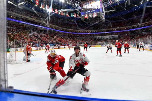 PRAGUE, CZECH REPUBLIC - MAY 19: Jonas Siegenthaler of Switzerland in a battle along the boards against Dawson Mercer of Canada during the preliminary round match between Switzerland and Canada at Prague Arena on May 19, 2024 in Prague, Czech Republic. Prague Prague Arena Czech Republic Copyright: xJustPictures.ch AndreaxBrancax jp-en-EuSpIm-AB_19052024_DSC_4477