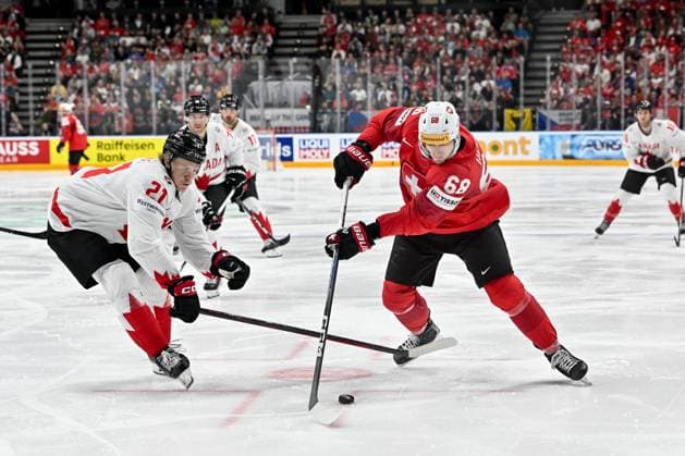 PRAGUE, CZECH REPUBLIC - MAY 19: Fabrice Herzog of Switzerland in action against Kaiden Guhle during the preliminary round match between Switzerland and Canada at Prague Arena on May 19, 2024 in Prague, Czech Republic. Prague Prague Arena Czech Republic Copyright: xJustPictures.ch AndreaxBrancax jp-en-EuSpIm-AB_19052024_AAB_8960
