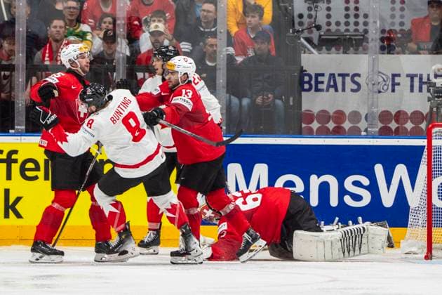 PRAGUE, CZECH REPUBLIC - MAY 19: Nico Hischier of Switzerland (2nd from R) defending goalkeeper Leonardo Genoni of Switzerland during the preliminary round match between Switzerland and Canada at Prague Arena on May 19, 2024 in Prague, Czech Republic. Prague Prague Arena Czech Republic Copyright: xJustPictures.ch JarixPestelaccix jp-en-EuSpIm-JP4_JAR_Switzerland_Canada_19May2024_199