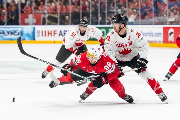 PRAGUE, CZECH REPUBLIC - MAY 19: Christoph Bertschy of Switzerland (L) tripped by Damon Severson of Canada (R) during the preliminary round match between Switzerland and Canada at Prague Arena on May 19, 2024 in Prague, Czech Republic. Prague Prague Arena Czech Republic Copyright: xJustPictures.ch JarixPestelaccix jp-en-EuSpIm-JP4_JAR_Switzerland_Canada_19May2024_250