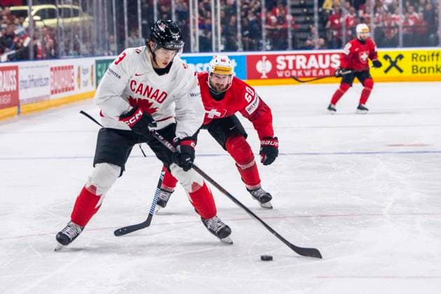 PRAGUE, CZECH REPUBLIC - MAY 19: Tristan Scherwey of Switzerland (R) against Olen Zellweger of Canada (L) during the preliminary round match between Switzerland and Canada at Prague Arena on May 19, 2024 in Prague, Czech Republic. Prague Prague Arena Czech Republic Copyright: xJustPictures.ch JarixPestelaccix jp-en-EuSpIm-JP4_JAR_Switzerland_Canada_19May2024_020