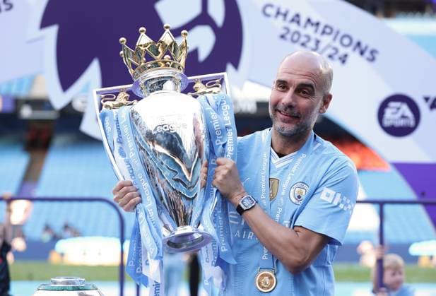 (240520) -- MANCHESTER, May 20, 2024 -- Manchester City s manager Pep Guardiola celebrates with the Premier League trophy after the English Premier League football match between Manchester City and West Ham United in Manchester, Britain, on May 19, 2024. (SP)BRITAIN-MANCHESTER-FOOTBALL-ENGLISH PREMIER LEAGUE-MANCHESTER CITY VS WEST HAM UNITED LixYing 
