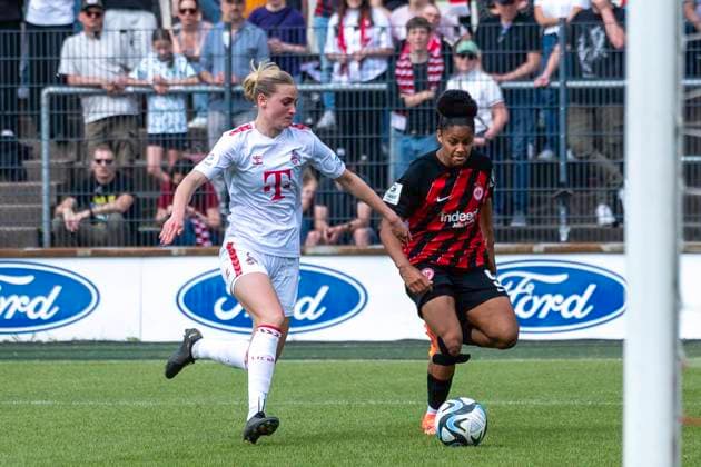 Fussball: Google Pixel Frauen-Bundesliga, Saison 2023 2024, 22. Spieltag, 1. FC Koeln - Eintracht Frankfurt am 20.05.2024 im Franz-Kremer-Stadion in Koeln. Zweikampf zwischen Sofie Vendelbo Laursen (1. FC Koeln, 02) und Shekiera Martinez (Eintracht Frankfurt, 09). Wichtiger Hinweis: Gemaess den Vorgaben der DFL Deutsche Fussball Liga bzw. des DFB Deutscher Fussball-Bund ist es untersagt, in dem Stadion und oder vom Spiel angefertigte Fotoaufnahmen in Form von Sequenzbildern und oder videoaehnlichen Fotostrecken zu verwerten bzw. verwerten zu lassen. Foto: Kirchner-Media TH Copyright: xKirchner-Media THx