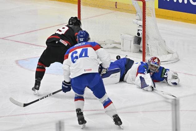Canada vs Slovakia quarter-final match of the 2024 IIHF World Championship, WM, Weltmeisterschaft in Prague, Czech Republic, on May 23, 2024. L-R scoring Jared McCann (CAN), Patrik Koch (SVK), goalkeeper Samuel Hlavaj (SVK). (CTKxPhoto VitxSimanek) CTKPhotoP2024052306362  CTKPhotoP2024052306362