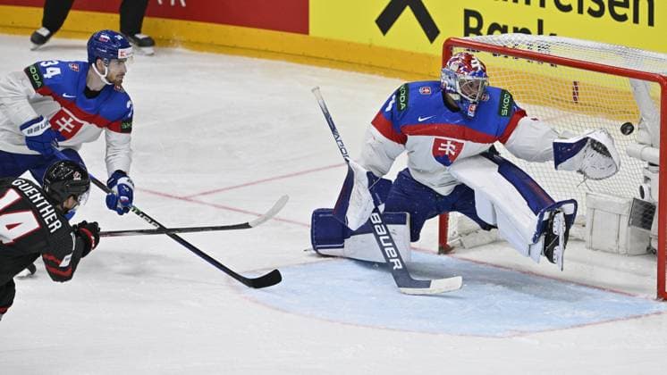 Canada vs Slovakia quarter-final match of the 2024 IIHF World Championship, WM, Weltmeisterschaft in Prague, Czech Republic, on May 23, 2024. L-R scoring Dylan Guenther (CAN), Peter Cehlarik (SVK), goalkeeper Samuel Hlavaj (SVK). (CTKxPhoto VitxSimanek) CTKPhotoP2024052307714  CTKPhotoP2024052307714