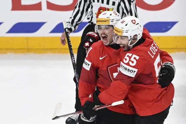 L-R Kevin Fiala and Romain Loeffel (both CAN) celebrate Fiala s goal (0:1) during the 2024 IIHF World Championship, WM, Weltmeisterschaft semi-final match Canada vs Switzerland, in Prague, Czech Republic, on May 25, 2024. (CTKxPhoto MichalxKamaryt) CTKPhotoP2024052505640  CTKPhotoP2024052505640