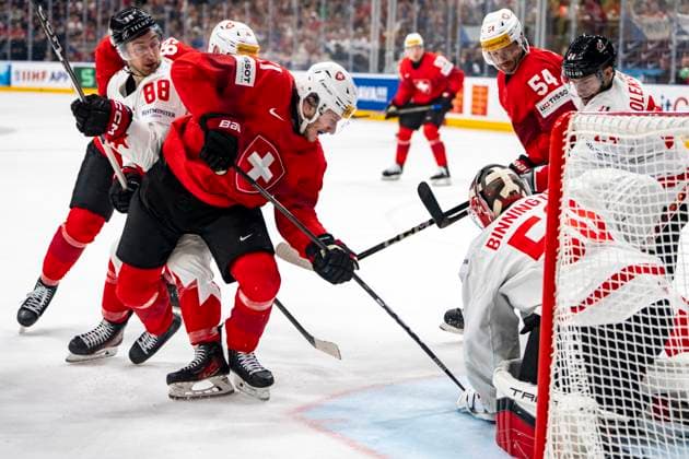PRAGUE, CZECH REPUBLIC - MAY 25: Sven Senteler of Switzerland (C) against Andrew Mangiapane of Canada (L) and goalkeeper Jordan Binnington of Canada (R) during the 2024 IIHF Ice hockey, Eishockey World Championship, WM, Weltmeisterschaft Czechia Semifinal match between Canada and Switzerland at Prague Arena on May 25, 2024 in Prague, Czech Republic. Prague Prague Arena Czech Republic Copyright: xJustPictures.ch JarixPestelaccix jp-en-EuSpIm-JP4_JAR_Canada_Switzerland_25May_2024076