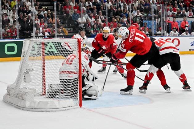 PRAGUE, CZECH REPUBLIC - MAY 25: Sven Senteler of Switzerland battle for the puck in front of goalkeeper Jordan Binnington of Canada during the 2024 IIHF Ice hockey, Eishockey World Championship, WM, Weltmeisterschaft Czechia Semifinal match between Canada and Switzerland at Prague Arena on May 25, 2024 in Prague, Czech Republic. Prague Prague Arena Czech Republic Copyright: xJustPictures.ch AndreaxBrancax jp-en-EuSpIm-AB_25052024_AAB_4376