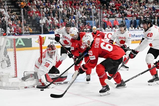 PRAGUE, CZECH REPUBLIC - MAY 25: Tristan Scherwey of Switzerland battles for the puck against goalkeeper Jordan Binnington of Canada during the 2024 IIHF Ice hockey, Eishockey World Championship, WM, Weltmeisterschaft Czechia Semifinal match between Canada and Switzerland at Prague Arena on May 25, 2024 in Prague, Czech Republic. Prague Prague Arena Czech Republic Copyright: xJustPictures.ch AndreaxBrancax jp-en-EuSpIm-AB_25052024_AAB_4409