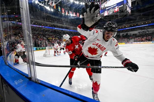 PRAGUE, CZECH REPUBLIC - MAY 25: Andres Ambuhl of Switzerland in a battle along the boards with Dylan Cozens of Canada during the 2024 IIHF Ice hockey, Eishockey World Championship, WM, Weltmeisterschaft Czechia Semifinal match between Canada and Switzerland at Prague Arena on May 25, 2024 in Prague, Czech Republic. Prague Prague Arena Czech Republic Copyright: xJustPictures.ch AndreaxBrancax jp-en-EuSpIm-AB_25052024_DSC_5763