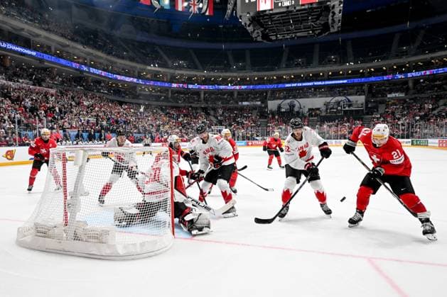 PRAGUE, CZECH REPUBLIC - MAY 25: Kevin Fiala of Switzerland in action against Dylan Cozens of Canada and goalkeeper Jordan Binnington of Canada during the 2024 IIHF Ice hockey, Eishockey World Championship, WM, Weltmeisterschaft Czechia Semifinal match between Canada and Switzerland at Prague Arena on May 25, 2024 in Prague, Czech Republic. Prague Prague Arena Czech Republic Copyright: xJustPictures.ch AndreaxBrancax jp-en-EuSpIm-AB_25052024_DSC_6000