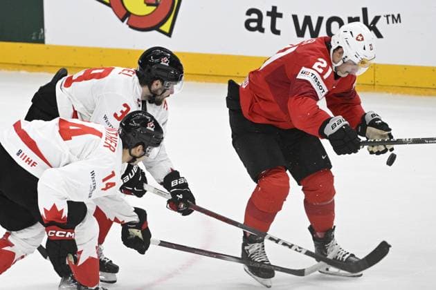 L-R Dylan Guenther (CAN), Brandon Hagel (CAN) and Kevin Fiala (SUI) in action during the 2024 IIHF World Championship, WM, Weltmeisterschaft semi-final match Canada vs Switzerland, in Prague, Czech Republic, on May 25, 2024. (CTKxPhoto MichalxKamaryt) CTKPhotoP2024052506218  CTKPhotoP2024052506218