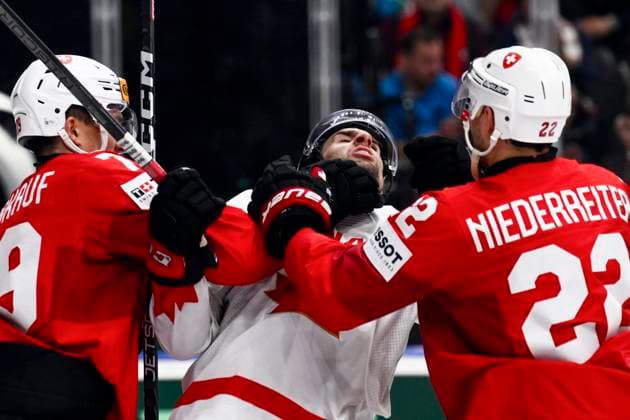 L-R Calvin Thurkauf (SUI), John Tavares (CAN) and Nino Niederreiter (SUI) in skirmish during the 2024 IIHF World Championship, WM, Weltmeisterschaft semi-final match Canada vs Switzerland, in Prague, Czech Republic, on May 25, 2024. (CTKxPhoto OndrejxDeml) CTKPhotoP2024052506249  CTKPhotoP2024052506249