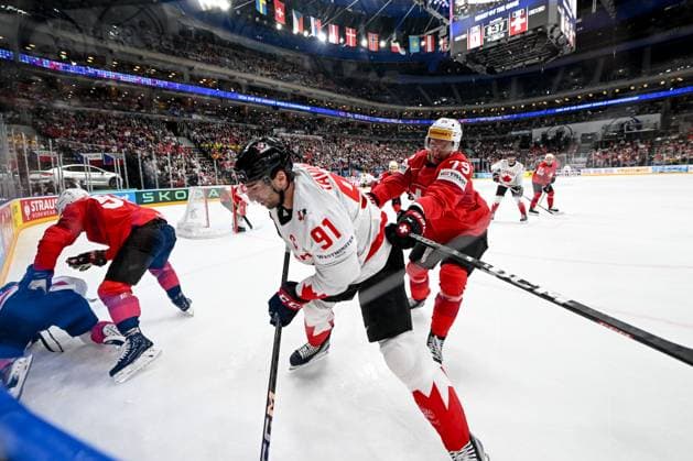 PRAGUE, CZECH REPUBLIC - MAY 25: Calvin Thurkauf of Switzerland checks John Tavares of Canada along the boards during the 2024 IIHF Ice hockey, Eishockey World Championship, WM, Weltmeisterschaft Czechia Semifinal match between Canada and Switzerland at Prague Arena on May 25, 2024 in Prague, Czech Republic. Prague Prague Arena Czech Republic Copyright: xJustPictures.ch AndreaxBrancax jp-en-EuSpIm-AB_25052024_DSC_6689