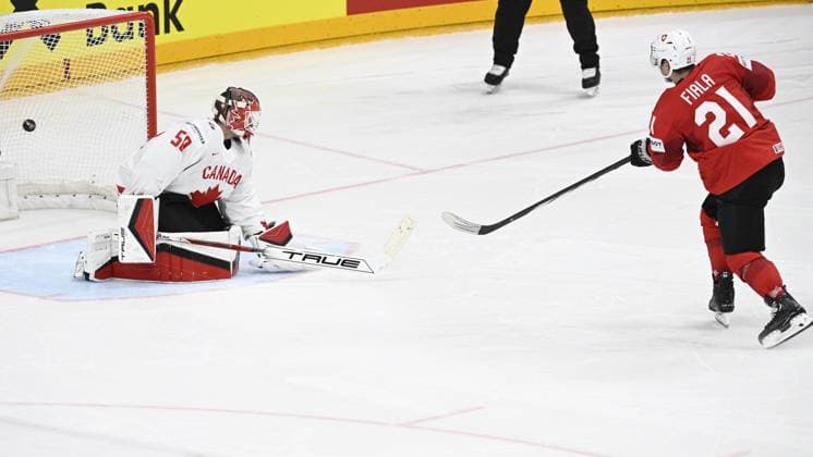 L-R goalkeeper Jordan Binnington (CAN) gets a goal by Kevin Fiala (SUI) during penalty shootout within the 2024 IIHF World Championship, WM, Weltmeisterschaft semi-final match Canada vs Switzerland, in Prague, Czech Republic, on May 25, 2024. (CTKxPhoto MichalxKamaryt) CTKPhotoP2024052506998  CTKPhotoP2024052506998