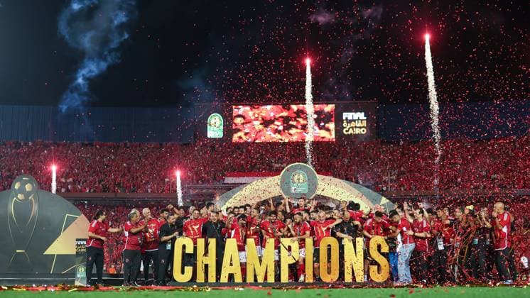 CAIRO, EGYPT - MAY 25: Al Ahly players, staff and head coach Marcel Koller celebrate on stage with a trophy after wining the CAF Champions League Final Second Leg match between Al Ahly and Esperance Sportive Tunis at Cairo International Stadium on May 25, 2024 in Cairo, Al Ahly v Esperance Sportive Tunis: Final Second Leg - CAF Champions League Copyright: xPhotoxbyxM.Bayoumy SFSIx