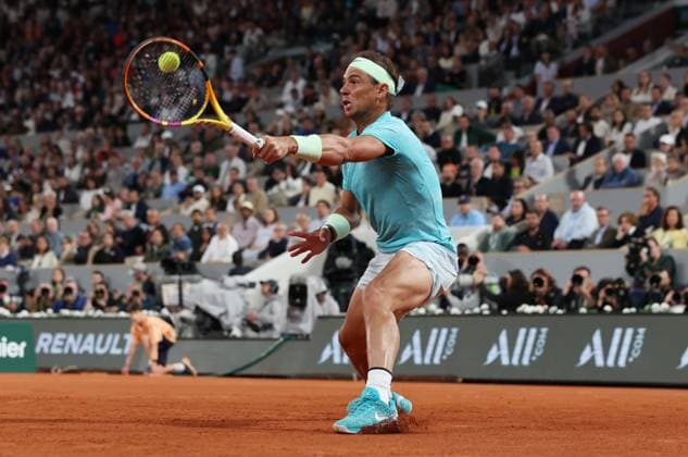 (240527) -- PARIS, May 27, 2024 -- Rafael Nadal of Spain hits a return to Alexander Zverev of Germany during the men s singles 1st round match at the French Open tennis tournament at Roland Garros, Paris, France, May 27, 2024. ) (SP)FRANCE-PARIS-TENNIS-FRENCH OPEN-MEN S SINGLES GaoxJing 