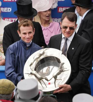 Sport Themen der Woche KW22 Sport Bilder des Tages Horse Racing - 2024 Flat Season - The Epsom Betfred Derby Festival - sixth Race. The Betfred Derby - Epsom Downs - Saturday 1st June 2024 Ryan Moore on City of Troy celebrates with trainer Aidan O™Brien and the Derby trophy 