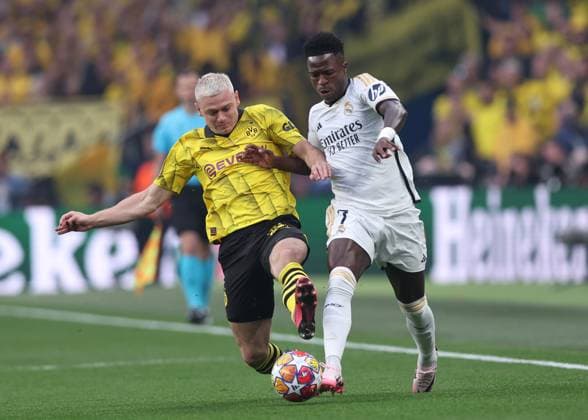 London, England, 1st June 2024. Julian Ryerson of Borussia Dortmund tackles Vinicius Junior of Real Madrid during the UEFA Champions League final match at Wembley Stadium, London. Picture credit should read: David Klein Sportimage EDITORIAL USE ONLY. No use with unauthorised audio, video, data, fixture lists, club league logos or live services. Online in-match use limited to 120 images, no video emulation. No use in betting, games or single club league player publications. SPI-3169-0075