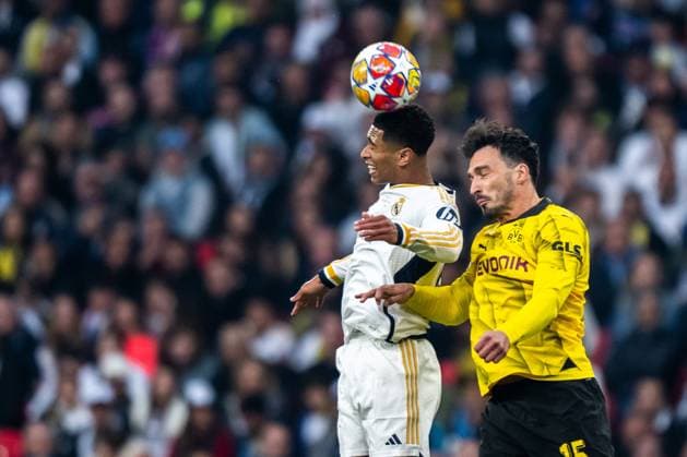 240601 Jude Bellingham of Real Madrid and Mats Hummels of Dortmund during the UEFA Champions League final between Dortmund and Real Madrid on June 1, 2024 in London. Photo: Petter Arvidson BILDBYRAN kod PA PA0818 fotboll football soccer fotball champions league final dortmund real madrid bbeng Copyright: PETTERxARVIDSON BB240601PA082