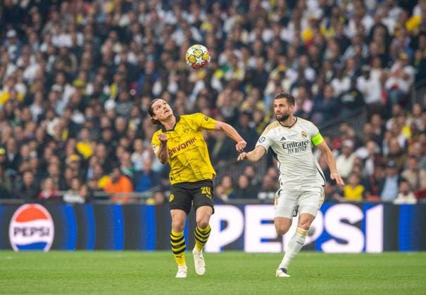 Fussball, Herren, Saison 2023 2024, Champions League (Finale), Borussia Dortmund - Real Madrid, v.l. Marcel Sabitzer (Borussia Dortmund), Nacho Fernandez (Real Madrid), 01.06.2024, Copyright: xSebastianxRäppold MatthiasxKochx