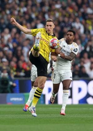 London, England, 1st June 2024. Julian Brandt of Borussia Dortmund tussles with Rodrygo of Real Madrid during the UEFA Champions League final match at Wembley Stadium, London. Picture credit should read: David Klein Sportimage EDITORIAL USE ONLY. No use with unauthorised audio, video, data, fixture lists, club league logos or live services. Online in-match use limited to 120 images, no video emulation. No use in betting, games or single club league player publications. SPI-3169-0087