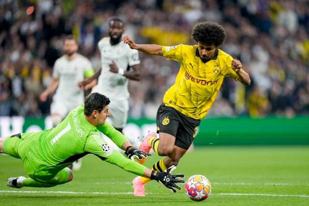 Torhueter Thibaut Courtois (Real Madrid) und Karim Adeyemi (Borussia Dortmund) battle for the ball, UEFA Champions League 2023 24 - Final, Borussia Dortmund vs Real Madrid CF, Wembley Stadium, June 1, 2024, London, United Kingdom.
