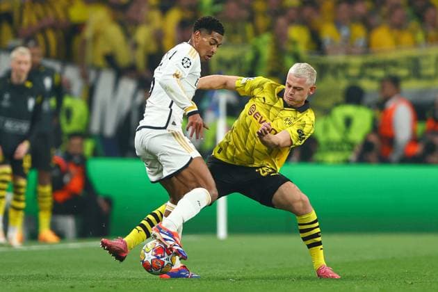 Jude Bellingham of Real Madrid battles with Julian Ryerson of Borussia Dortmund Borussia Dortmund v Real Madrid, UEFA Champions League, Final, Football, Wembley Stadium, London, UK - 01 June 2024 EDITORIAL USE ONLY No use with unauthorised audio, video, data, fixture lists, club league logos or live services. Online in-match use limited to 120 images, no video emulation. No use in betting, games or single club league player publications.  Copyright: xKieranxMcManus Shutterstockx 14516313bv