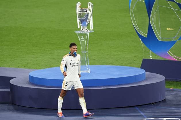 Jude Bellingham of Real Madrid walks past the Champions League trophy with their winners medal Borussia Dortmund v Real Madrid, UEFA Champions League, Final, Football, Wembley Stadium, London, UK - 01 June 2024 EDITORIAL USE ONLY No use with unauthorised audio, video, data, fixture lists, club league logos or live services. Online in-match use limited to 120 images, no video emulation. No use in betting, games or single club league player publications. Copyright: xPaulxCurrie Shutterstockx 14516316fi