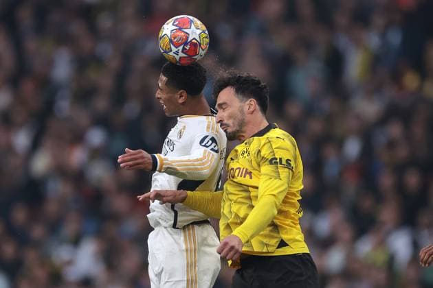 London, England, 1st June 2024. Jude Bellingham of Real Madrid and Mats Hummels of Borussia Dortmund battle for an aerial ball during the UEFA Champions League match at Wembley Stadium, London. Picture credit should read: Jonathan Moscrop Sportimage EDITORIAL USE ONLY. No use with unauthorised audio, video, data, fixture lists, club league logos or live services. Online in-match use limited to 120 images, no video emulation. No use in betting, games or single club league player publications. SPI-3168-0018