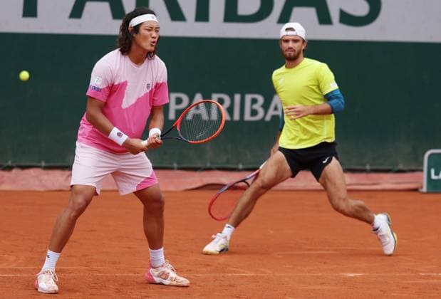 (240602) -- PARIS, June 2, 2024 -- Zhang Zhizhen (L) Tomas Machac react during the men s doubles first round match between Zhang Zhizhen (China) Tomas Machac (the Czech Republic) and Andras Mies (Germany) Neal Skupski (Britain) at the French Open tennis tournament at Roland Garros in Paris, France, June 2, 2024. ) (SP)FRANCE-PARIS-TENNIS-FRENCH OPEN-MEN S DOUBLES GaoxJing 
