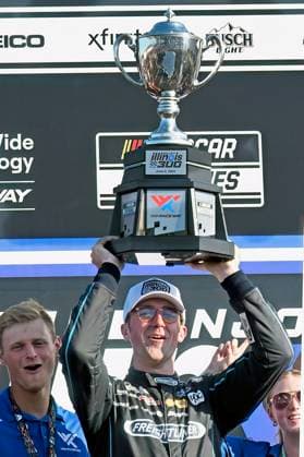 Sport Themen der Woche KW22 Sport Bilder des Tages NASCAR, Motorsport, USA driver Austin Cindric celebrates by holding the winners trophy after winning the World Wide Technology Raceway Enjoy Illinois 300 in Madison, Illinois on Saturday, June 2, 2024.  SLP2024060209 BILLxGUTWEILER