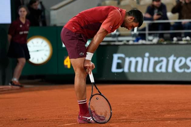 PARIS, FRANCE - JUNE 2: Novak Djokovic of Serbia looks exhausted during the round of 8 of match between Novak Djokovic vs Lorenzo Musetti at Roland Garros Stadium on June 2, 2024 in Paris, France. (Photo by Glenn Gervot Icon Sportswire) TENNIS: JUN 01 Roland-Garros EDITORIAL USE ONLY Icon20240602161532024